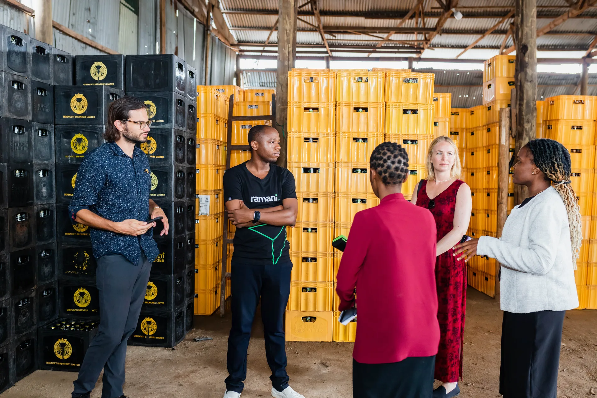 Distribution team reviewing crate inventory in a warehouse